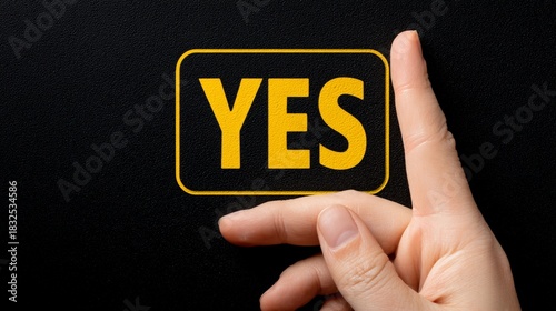 A hand points toward the word 