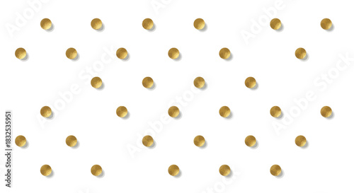 Close-up of multiple golden pills or capsules arranged in a pattern on a white background