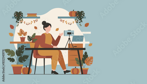 Autumn Vlogger Woman recording video content at a festive home desk setup Work from home concept