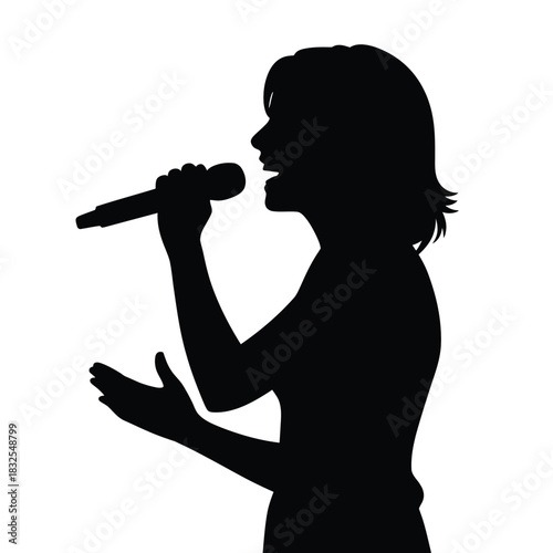 Silhouette of a young woman singing into a microphone with passion
