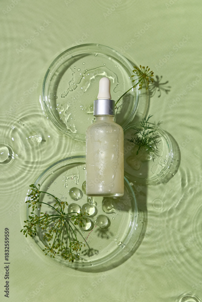 Obraz premium Composition with bottle of dill cosmetic product and Petri dishes in water on green background, closeup
