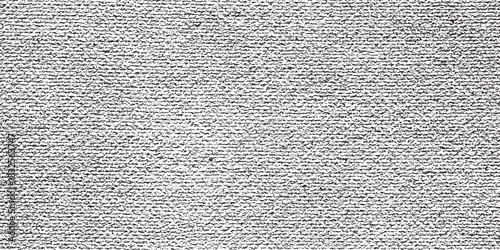 Close up of a textured fabric surface with a woven pattern.