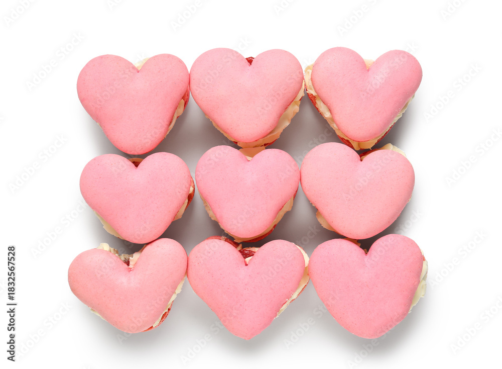Fototapeta premium Many sweet heart-shaped macaroons on white background. Valentine's Day celebration