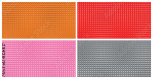 Red orange pink gray toy baseplates arranged in colorful composition, plastic construction brick background with circular connectors, ideal for creative building design learning material education