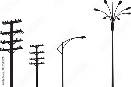 Silhouette of different styles of utility poles and street lights