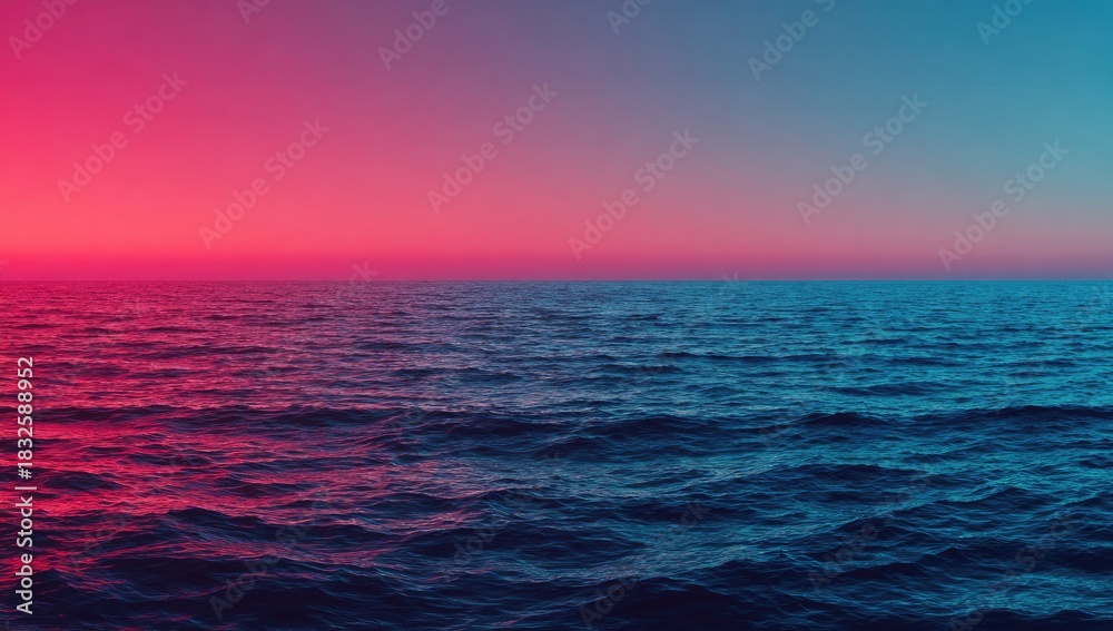 Fototapeta premium Ocean surface at twilight with pink and blue sky.