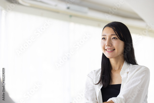 Smiling Woman Shaking Hands in Bright Office Setting Free Download Smiling Woman Shaking Hands in Bright Office Setting - GFXLoad