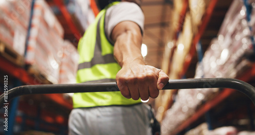 Foto Hand, logistics and trolley with man in warehouse aisle for delivery, distribution or shipping