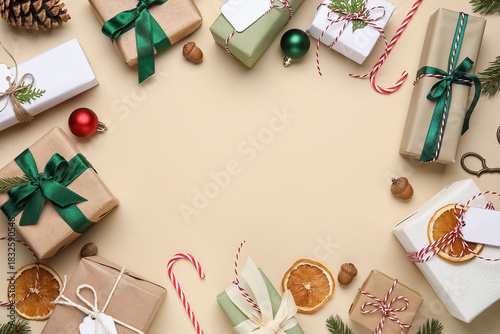 Wallpaper Mural Frame made of Christmas gift boxes, fir tree branches and decor on beige background Torontodigital.ca