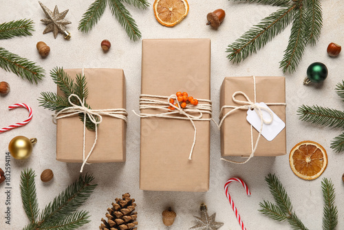 Christmas gifts on grey bac...