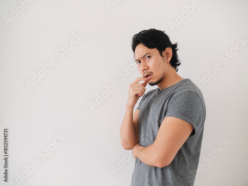 Reaction of Asian man thinking and trying to fix the problem seriously.