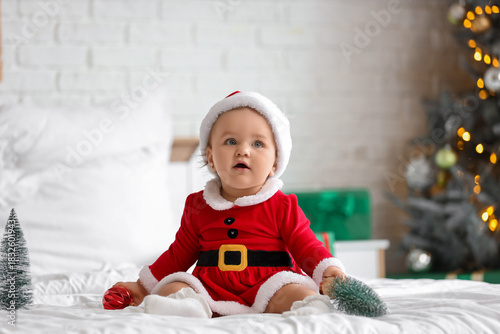 Cute little baby in Santa c...