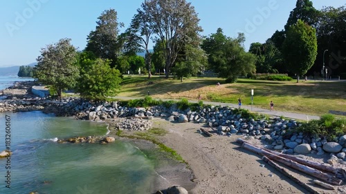 Wallpaper Mural People Walking and Running Along Stanley Park Seawall from During Bright Sunny Morning on Coastline Waterfront Torontodigital.ca