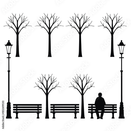 Silhouette of person on park bench under bare trees and lamppost sitting