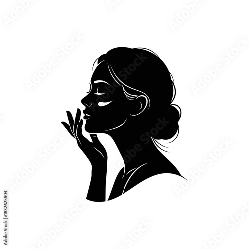 Elegant silhouette of a contemplative woman with flowing hair in minimalist