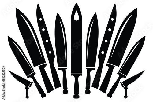 Black knife collection with various shapes and sizes fanning out on a white surface makes an impressive display