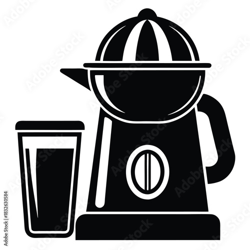 Black juicer machine stands next to a clear glass cup filled with liquid