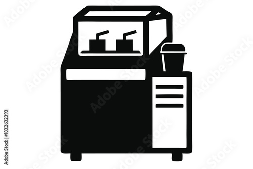 Black and white vending machine displays refreshment with cup and straw on top