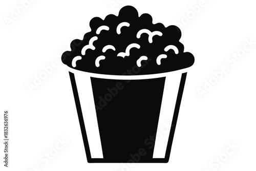 Single popcorn bucket icon with overflowing kernels offers a classic monochrome movie treat