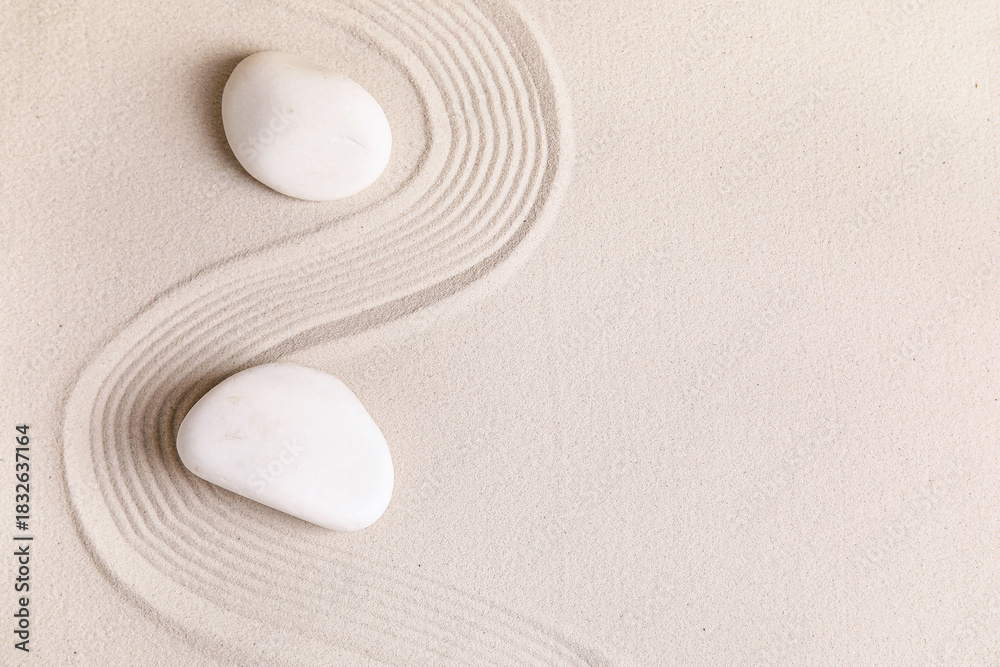 Naklejka premium Composition with stones and lines on sand as background. Zen concept