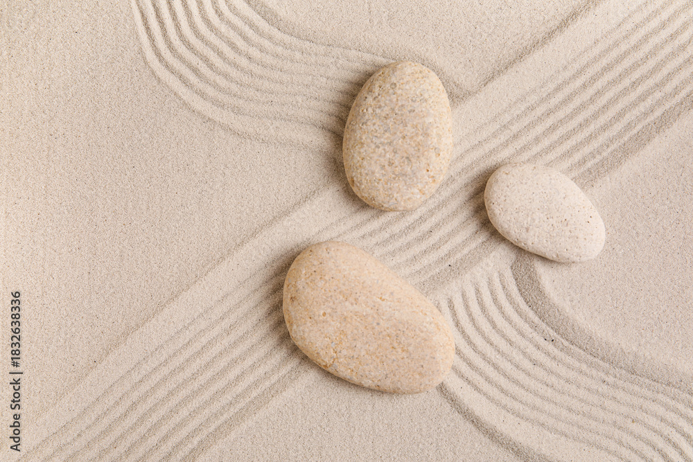 Naklejka premium Composition with spa stones and lines on sand as background, closeup. Zen concept