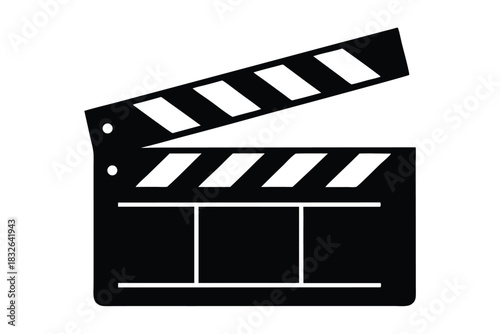 A black film clapperboard with white stripes is seen open, ready for filming