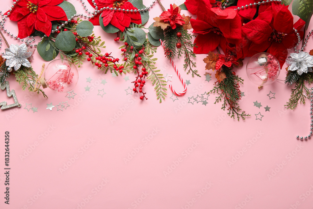 Naklejka premium Composition with Christmas poinsettia flowers and decorations on pink background