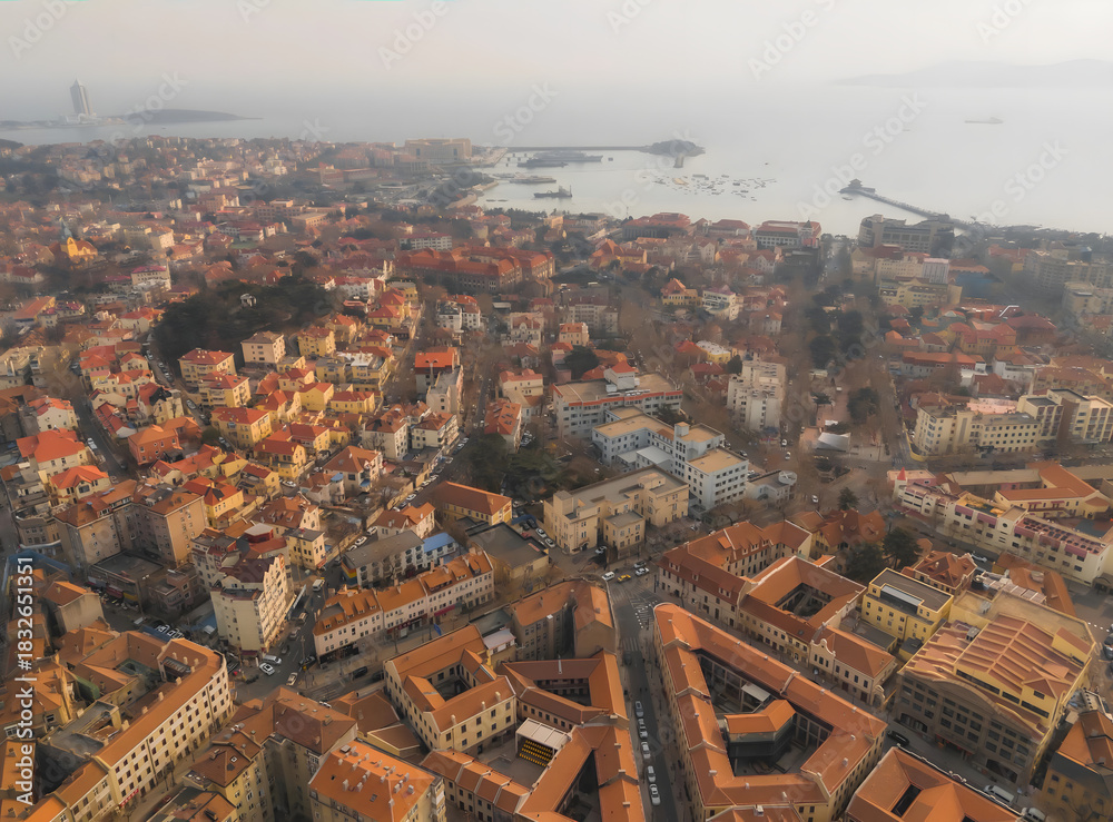 Obraz premium Qingdao Harbor Aerial View With Red Tile Roofs and Coastal Architecture
