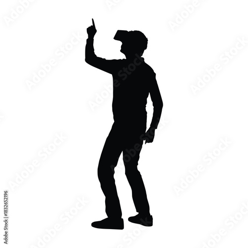 Man Silhouette Wearing VR Headset Pointing Upward. Concept of Virtual Reality, Future Technology, Gaming, and Metaverse Experience.