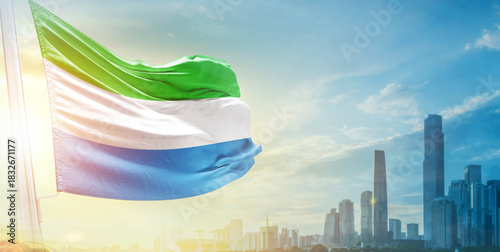 Photos Sierra Leone flag wavering in beautiful clouds with building skyline