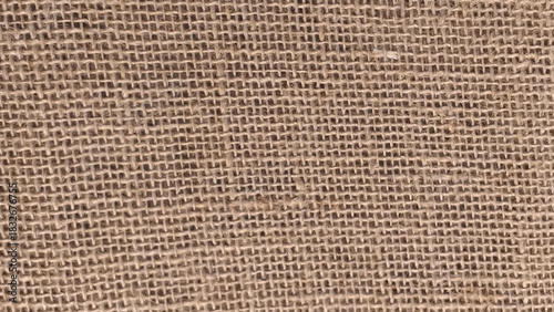 Detailed macro of natural burlap fabric with visible rough woven fibers and grid pattern, perfect for backgrounds and rustic design.