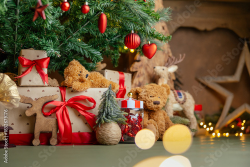Beautifully illuminated Christmas decoration with sparkling lights, Christmas trees, stars, teddy bears and presents.	
