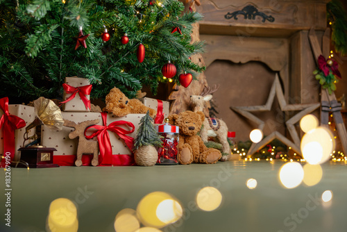 Beautifully illuminated Christmas decoration with sparkling lights, Christmas trees, stars, teddy bears and presents.	
