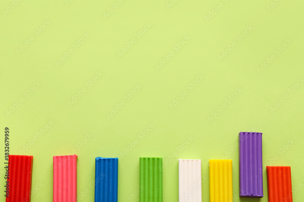 Obraz premium Colorful plasticine on green background