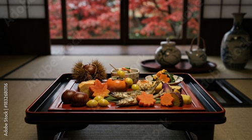 Traditional Japanese autumn dishes in Tatami room with garden view