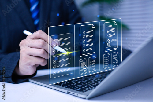 
Businessman working on computer using laptop business performance tracking and evaluation concept. Filling out online surveys. Digital form checklist