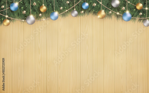 光輝くクリスマスツリーと、横長の木目の背景