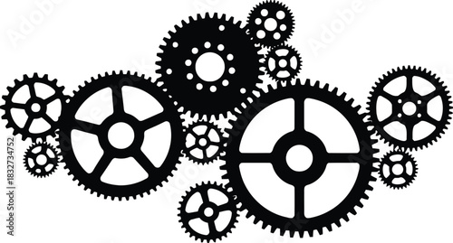 Silhouette of interlocking mechanical gears in various sizes.