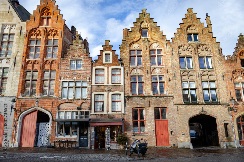 Fototapeta premium Traditional building architecture along a plaza in Brugge in Flanders, Belgium