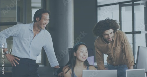 Reviewing project, Asian woman wearing headband collaborating with coworkers at office with laptops