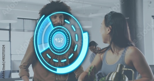 Talking coworkers wearing brown shirt and grey tank, leaning at office counter with blue holo 91