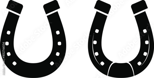 Two black horseshoe silhouettes isolated on white background for luck and symbolism