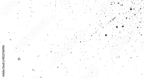 Black ink splatters and dots on a white background abstract texture blot