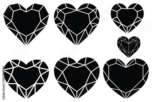 Black faceted heart shaped gemstones on white background