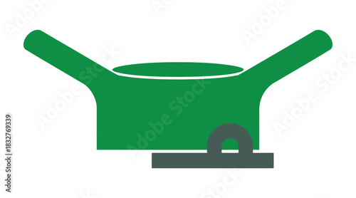 A green saucepan with a handle and a gray lid rests on a stove.