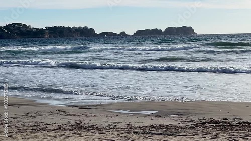 Paguera beach with strong wind , high Waves and Surfer, Calvia, Mallorca, Spain