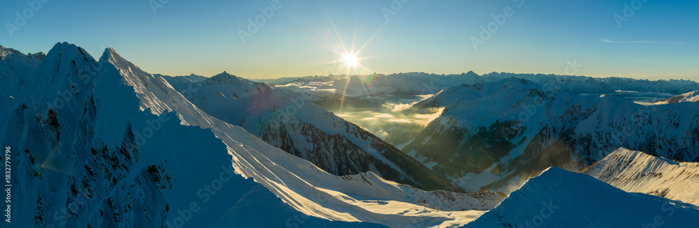 Naklejka premium Panorama view of a snow-covered high mountains in Austria Alps