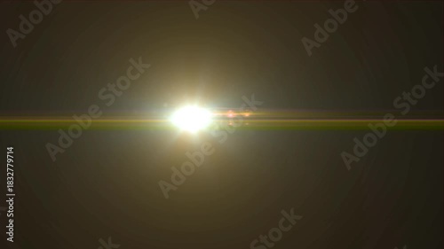 Flashing rays of light in the middle of the screen creating a flare effect, reflections on a dark background, abstraction.