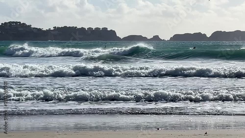 Paguera beach with strong wind , high Waves and Surfer, Calvia, Mallorca, Spain