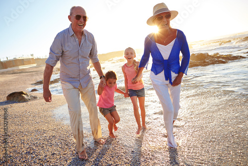 Canvas Print Grandparents, grandchildren and holding hands in ocean with walk, summer holiday and bonding together